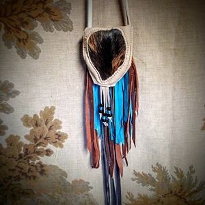 White Deerskin Medicine Bag with hair-on cowhide applique and extra long Fringe